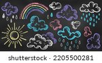 Set of Design Elements Sun, Clouds, Rain, Rainbow of Different Colors Isolated on Chalkboard Backdrop. Realistic Chalk Drawn Sketch. Kit of Textural Crayon Drawings of Sky Symbols on Blackboard.