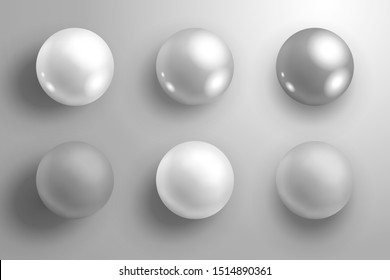 Set for design. Monochrome shiny and matte balls are on the surface. Top view with realistic shadows under different angle of incidence of light