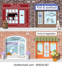 Set of detailed butcher, fish, dairy, fruits and vegetables shops. Barrel with meat and cart with vegetables at the fore. Building facade of brown and red brick. Vector illustration eps 10.