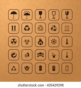 Set of different black cargo symbols on cardboard texture