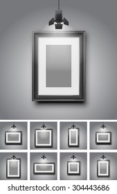 Set of different black frames gallery room gray wall interior illuminated with spotlights. Realistic 3d vector illustration