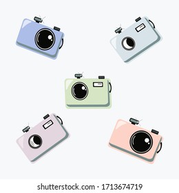 
 Set of different cartoon cameras. Multi-colored cameras. 
Vector illustration on a white background.