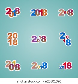 Set of different colored figures composed of small triangles. Kit numbers years 2018 of various colors, shapes and sizes of geometric elements on a blue background 