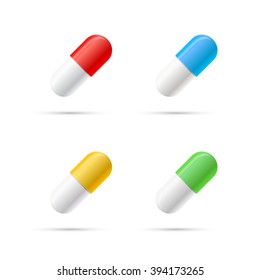 Set of different colours pills, capsules isolated on white