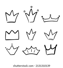 Set of different crowns and tiaras. Hand drawn doodle crown isolated on white background. Vector sketch