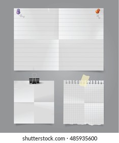 Set of different folded papers with pins, paperclip and adhesive tape.