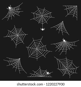 a set of different kinds of web of white with spiders of white on a dark background