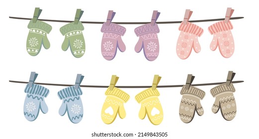 Set of different knitted mittens hanging on the rope. Cute hand drawn elements for winter design. Winter clothes. Vector illustration.