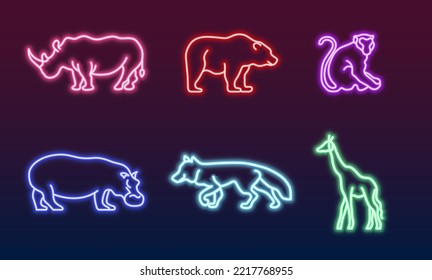 Set of different neon animals icons. Vector illustration of rhinoceros,bear,monkey,hippopotamus,fox,giraffe isolated on dark background.