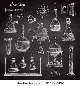 Set of different pharmaceutical flasks, beakers and test tubes. Sketch of chemical laboratory objects on a chalk board. Discovery and chemistry symbol.