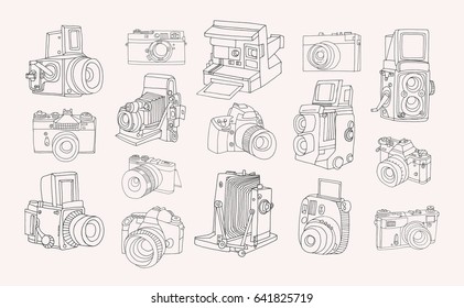 Set of different photo cameras. Hand drawn contour collection in doodle style.