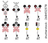Set of different railway crossing signals with warning signs