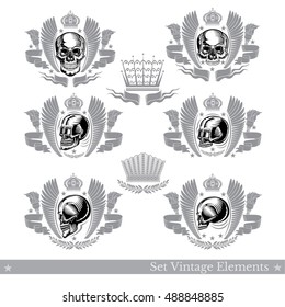 Set of different skulls with wings ribbons and vintage element. Vector heraldic design elements