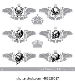 Set of different skulls with wings, wreath and vintage element. Vector heraldic design elements