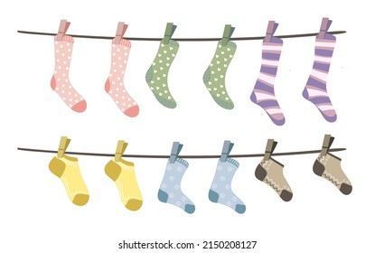 Set of different socks hanging on the rope. Cotton or wool socks dry and hang on laundry string with clothespins. Vector illustration