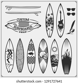 Set of different surfboards. Vector illustration. Surfing emblems, icons and labels.