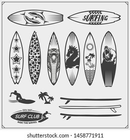 Set of different surfboards. Vector illustration. Surfing emblems, icons and labels.