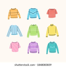 Set of different sweaters,  jumpers, t-shirts, blouses, turtlenecks. Stylish clothes with various decorations. Vector hand drawn illustration. 