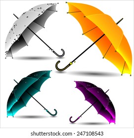 Set of different umbrellas in rain drops.