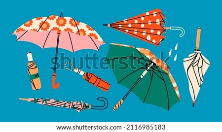 Set of different Umbrellas in various positions. Open and folded umbrellas. Various prints. Hand drawn colored Vector illustration. Cartoon style. Design templates. All elements are isolated