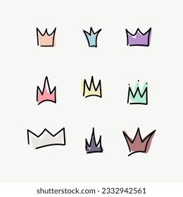 set of different variations of coloring crowns hand drawn on doodle style and isolated on background
