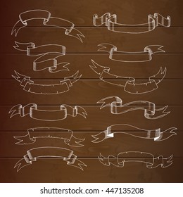 Set different vintage ribbons on a wooden background. Drawing by hand, sketch. Decor for advertising or web in an old style. Vector
