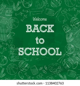 Set of different white chalk school equipment with back to school text isolated on dark green board