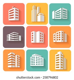 Set of dimensional buildings  colored icons in white with shadow depicting high-rise commercial buildings  office blocks and residential apartments 