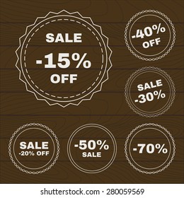 Set of discount badges on dark wood texture. Special offer. Vector EPS 10.