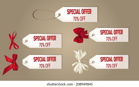 Set of discount tags with the silk red und white ribbons