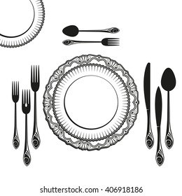 set of dishes, such as plates, forks, spoons and knives 