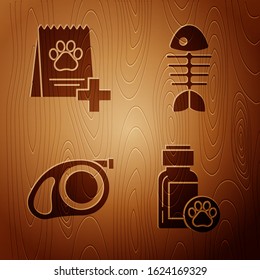 Set Dog medicine bottle, Bag of food for dog, Retractable cord leash with carabiner and Fish skeleton on wooden background. Vector