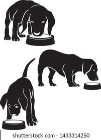 set of dogs with a bowl