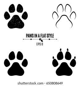 A set of dog's paws. Black traces in different styles. Isolated on white background. Silhouettes of paws. Vector illustration svg