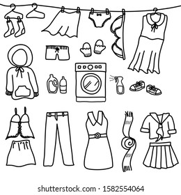 A set of doodle drawing style about laundry isolated on white background. There’s a washing machine at the center and various clothes around.