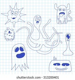 Set of doodle monsters icons on notebook
