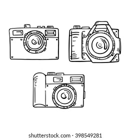 Set of doodle photo cameras. Vector hand draw illustration. Sketch lines.