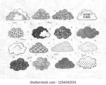 Set of doodle sketch clouds on rice paper background.