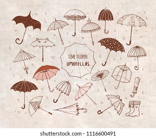 Set of doodle sketch umbrellas on vintage background.