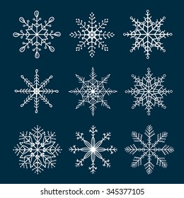 Set of doodle snowflakes isolated on dark background. Winter collection. Hand drawn vector symbols. 