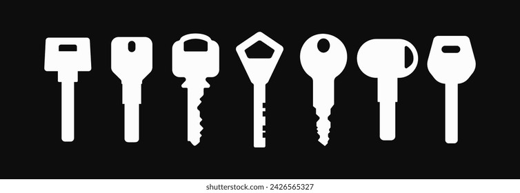 Set of Door keys white silhouettes on dark background. Vector objects