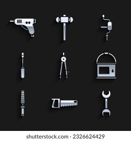 Set Drawing compass, Hand saw, Wrench spanner, Paint bucket, Chisel tool for wood, Screwdriver, drill and Electric hot glue gun icon. Vector