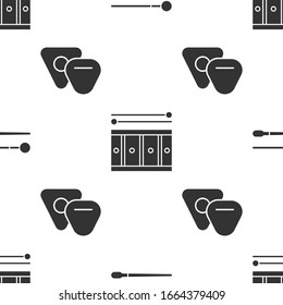 Set Drum sticks, Drum with drum sticks and Guitar pick on seamless pattern. Vector