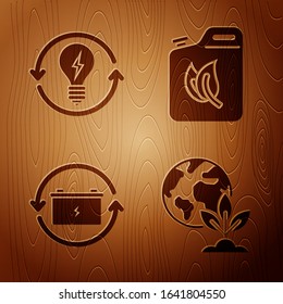 Set Earth globe and plant, Recycle and light bulb with lightning symbol, Battery with recycle symbol and Bio fuel canister on wooden background. Vector