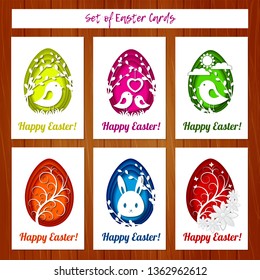 Set of Easter cards with colorful eggs in paper cutting style on wooden background. Imitation paper art style. Template for greeting Easter cards.