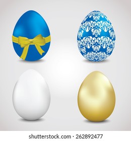 Set of Easter eggs blue, golden and a bow.