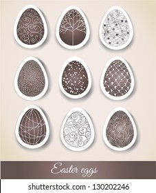 Set of Easter eggs with patterns on cut paper. Vector illustration