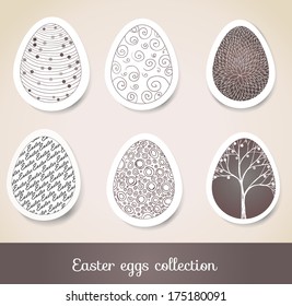 Set of Easter eggs with patterns on cut paper. Vector illustration 