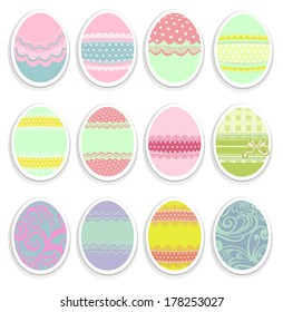 Set of Easter eggs with patterns and ribbons on cut paper