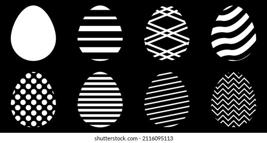 Set of Easter eggs. White patterns on a black background. Vector graphics.